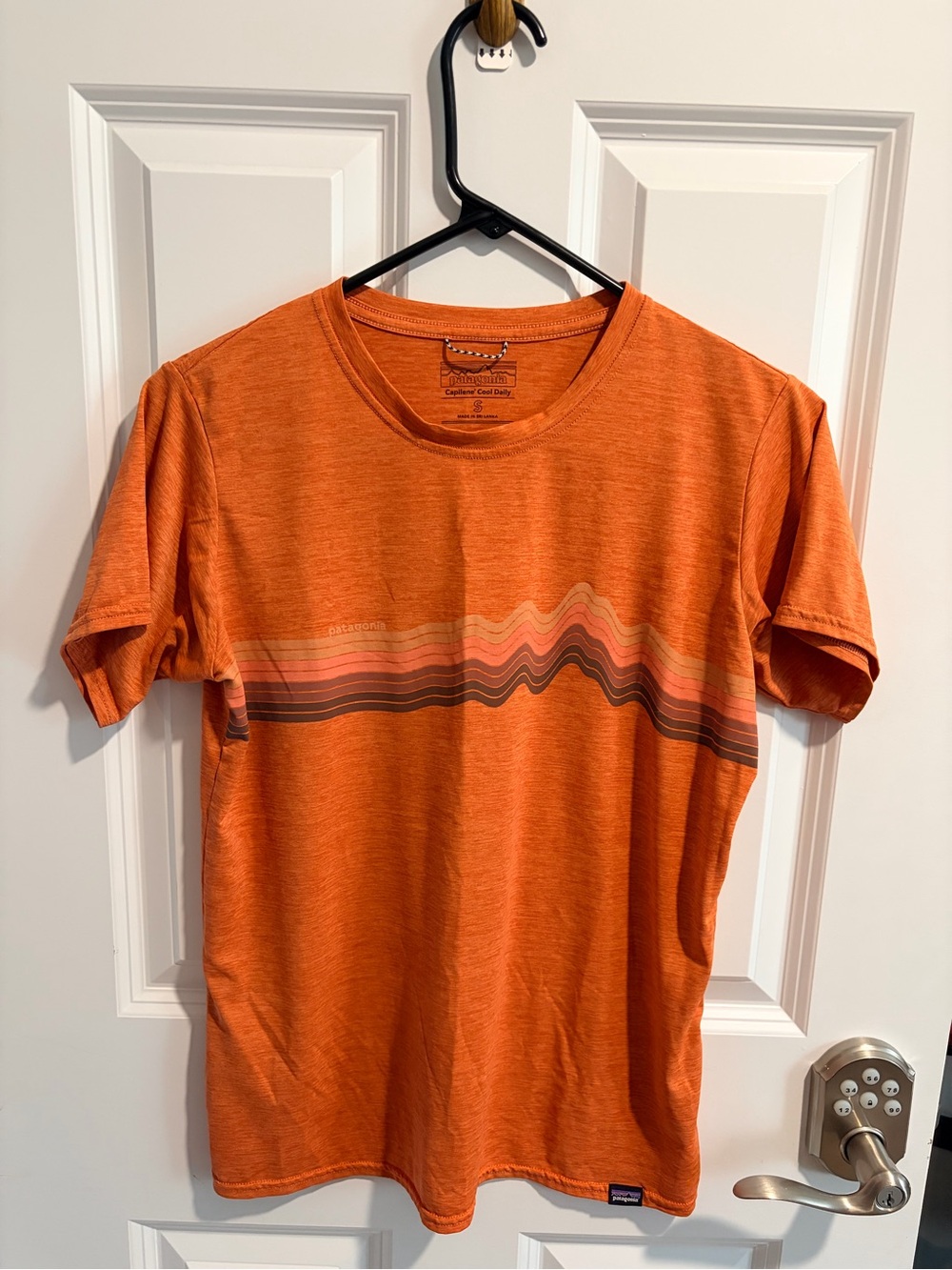 Patagonia Orange Short Sleeve Tee with Multicolor Wave Stripe